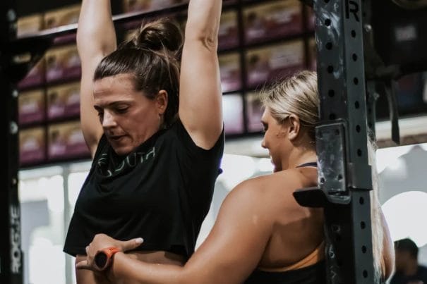 Woman working out with coach